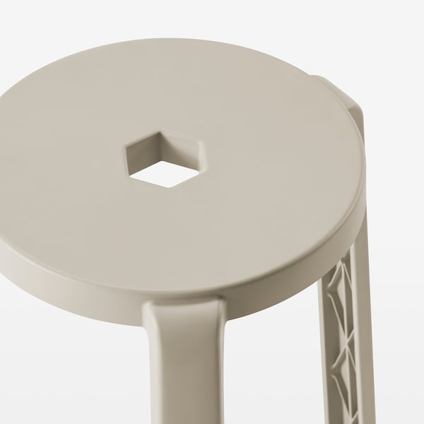 Round stool with 3 legs, light beige, sleek finish, crafted from recycled plastic.