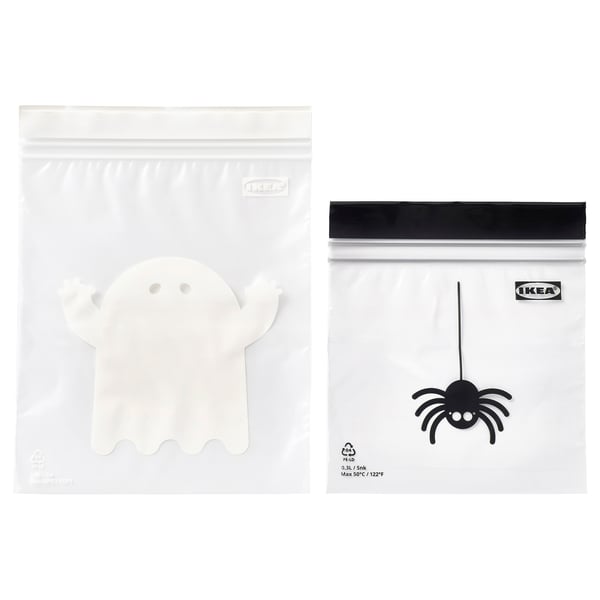 Two clear plastic IKEA bags, one with a white ghost, the other with a black spider.
