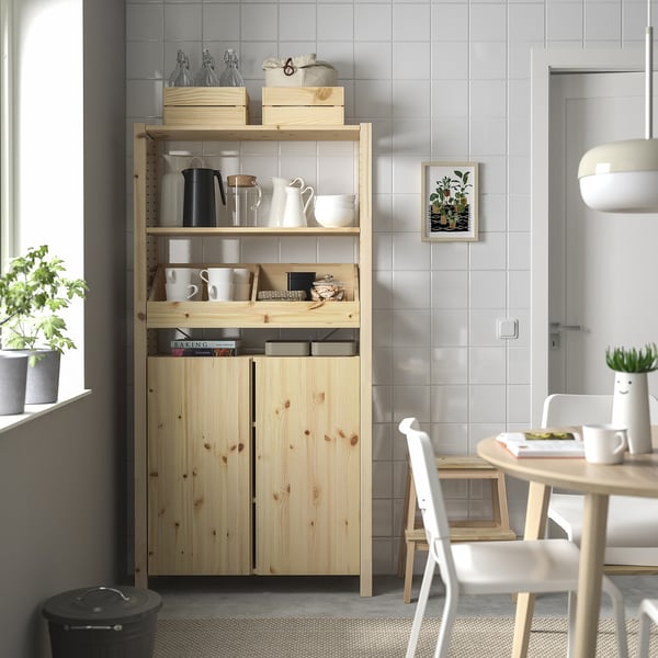 IVAR storage unit beside window with kitchen items.
