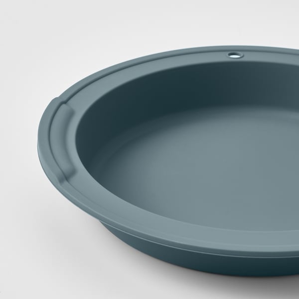 Round blue silicone baking dish; smooth, even surface; sturdy build quality.