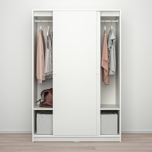 White wardrobe with sliding doors, two hanging sections, shelf with folded clothes, lower shelf with basket, clothes on hangers.