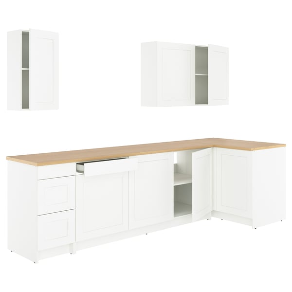 The KNOXHULT kitchen set white cabinets with wooden countertops, an l-shaped design, and ample storage spaces.