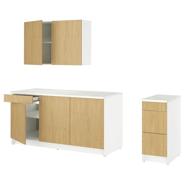 A set of modern light wood and white kitchen cabinets. Base and wall units with a marble effect countertop.