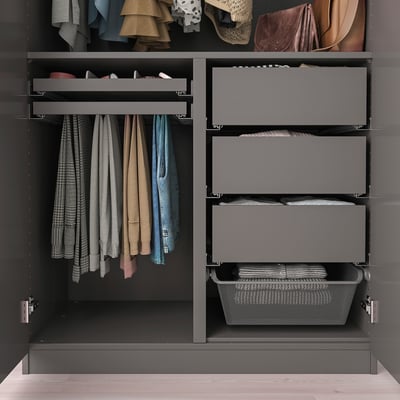 Wardrobe organiser with hanging shirts, folded clothes, and storage bins.