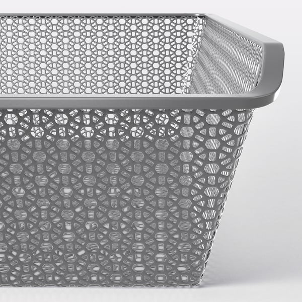 Metal basket with intricate cutouts, ideal for air circulation and organising clothes, displayed on a pulley system.