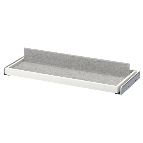 A white KOMPLEMENT pull-out tray with grey felt liner, designed for organising wardrobe items.