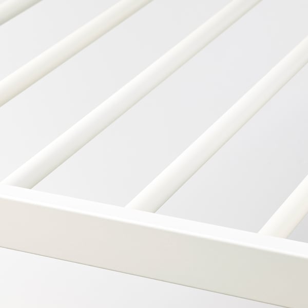 Close-up of sleek, white, high-quality trouser hanger rail.