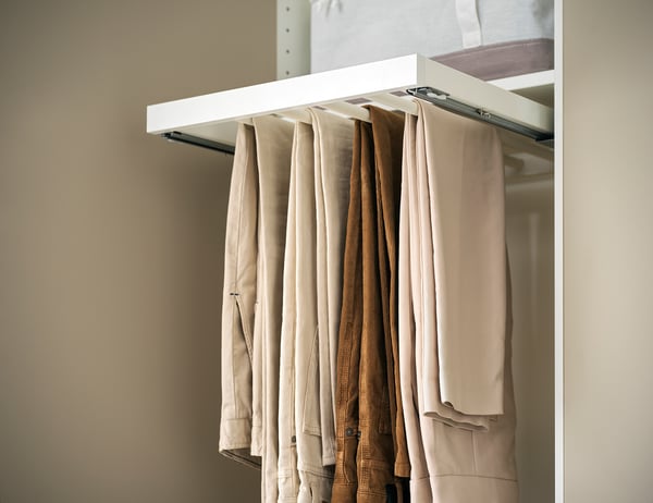 KOMPLEMENT trouser hanger, white, metal, holds beige pants, organised.