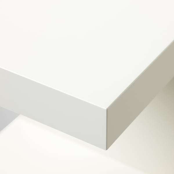 Modern, minimalist white wall shelf, clean edges, sleek design. Perfect for small spaces.