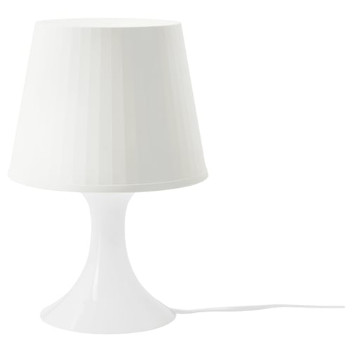 Ikea LAMPAN white lamp, sleek design creates cozy mood light.