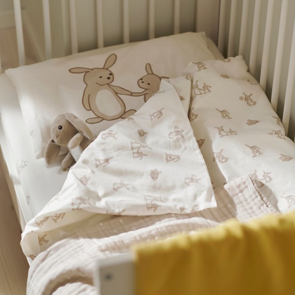 LEN Duvet cover 1 pillowcase for cot, white beige/bunny pattern, 110x125/35x55 cm