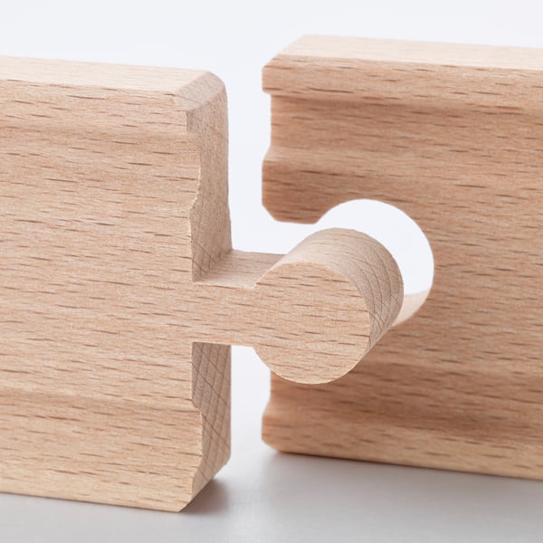 Precision-crafted wooden interlocking puzzle pieces, smooth texture, clean finish.