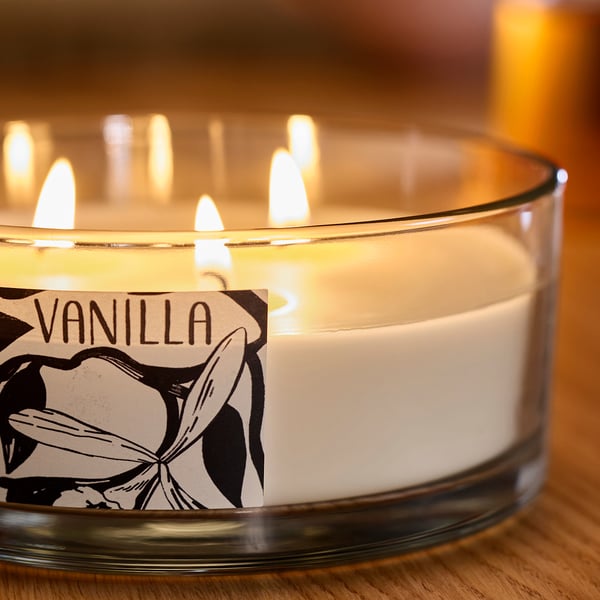 LOTSFÅGEL Scented candle/glass w lid/3 wicks, Vanilla pale beige, 25 hr