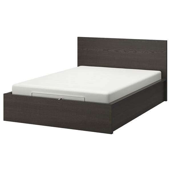 A modern dark grey MALM bed with a white mattress and a high headboard, offering spacious under-bed storage.
