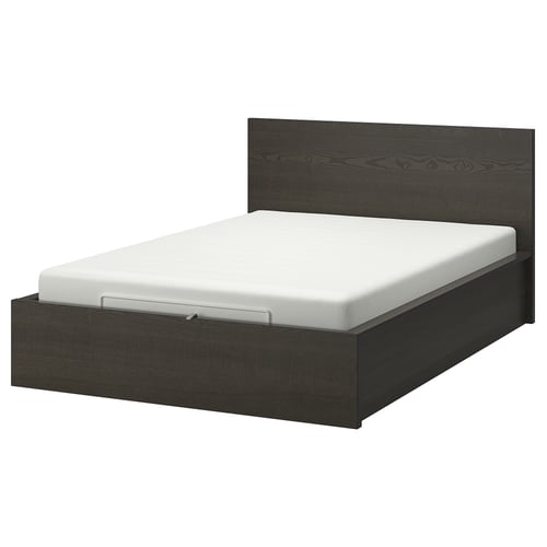A modern dark grey MALM bed with a white mattress and a high headboard, offering spacious under-bed storage.