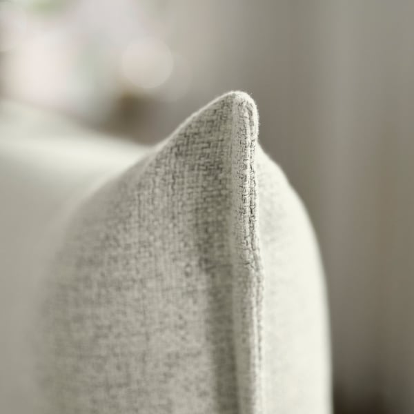 Close-up of textured, high-quality sofa fabric, displaying intricate weave and soft finish.