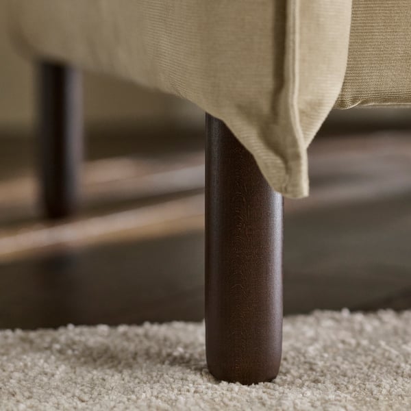 Sofa with sturdy wooden leg, beige upholstery, cosy and sturdy.