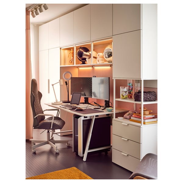 Home office with MISSMYRA led strips, desk, chair, shelves, orange wall, carpet.