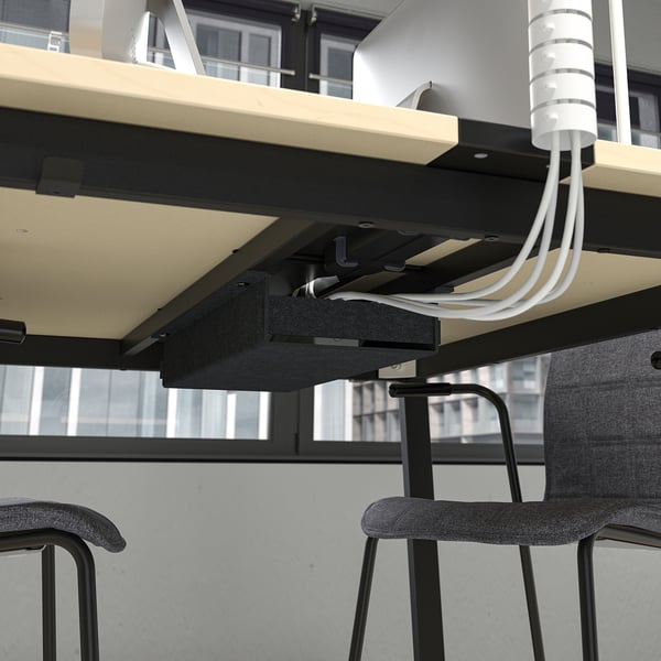 Under-table cable management with hooks.