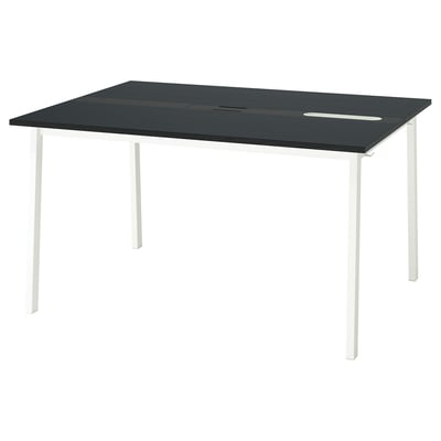 A MITTZON conference table, black with white legs, rectangular, modern design.