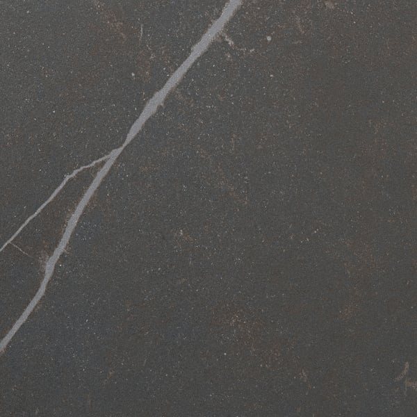 Close-up of MÖCKLARP worktop, smooth, dark, minimal scratches, high-quality porcelain finish.