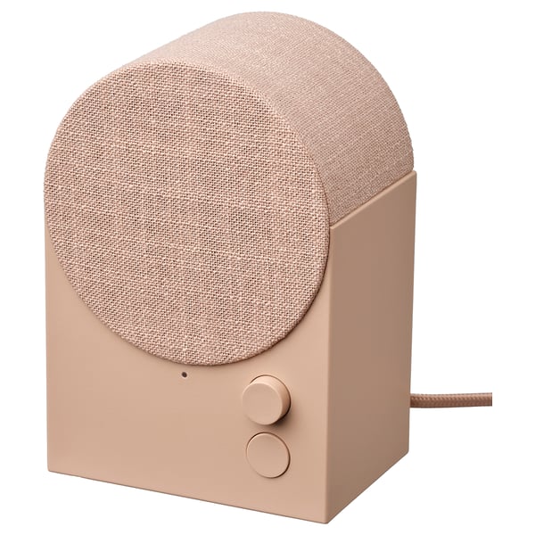 NATTBAD bluetooth speaker, peach, fabric-covered, flat front, round top, minimalist design.