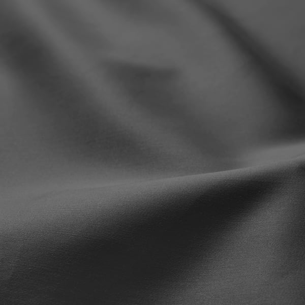 Close-up view of sleek, sateen-woven fabric with smooth texture and lustrous finish.
