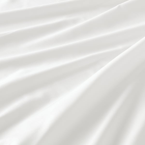 Smooth, crisp white bedsheet, finely woven, soft & lustrous.
