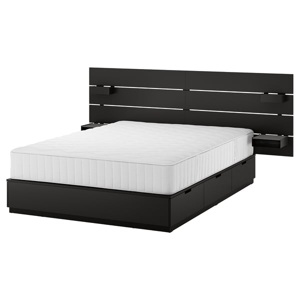 Modern black bed with white mattress, built-in storage, and led lights in headboard.