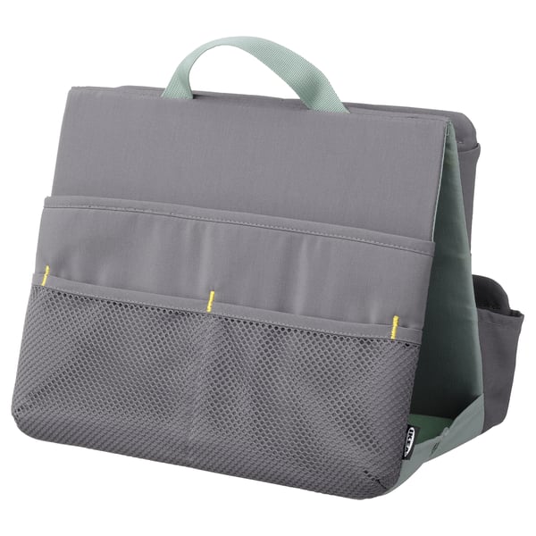 A grey ÖVNING organiser bag with a green handle and mesh pocket, designed for holding school supplies.