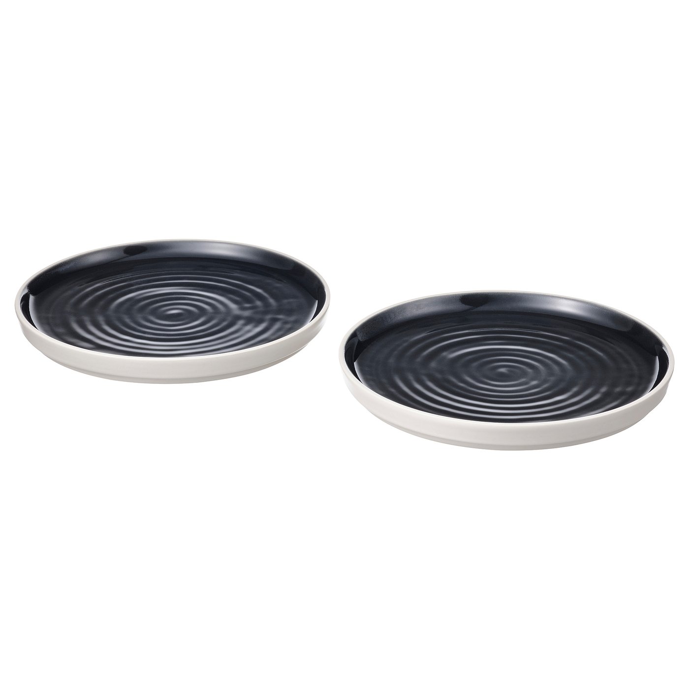 Two black, round, ceramic dishes with white rims and swirling patterns, positioned side by side.