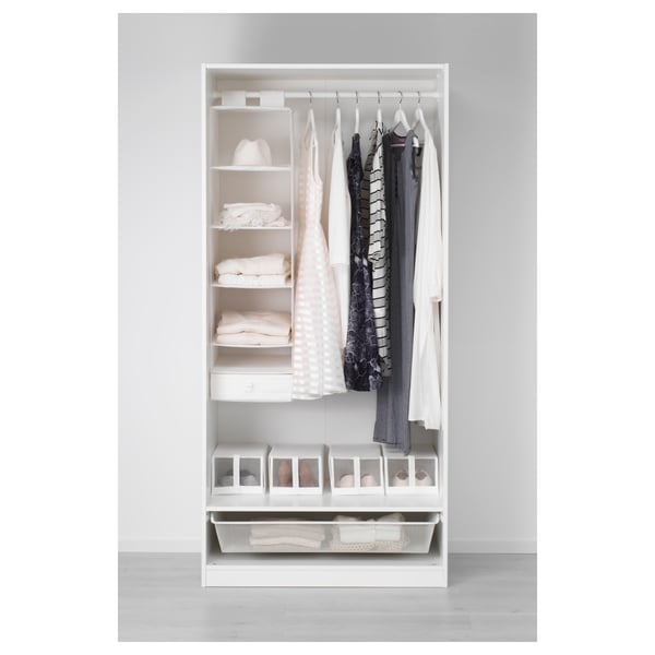 Open wardrobe with plates, clothes, and accessories organised on shelves, hanging rail, and mesh basket.