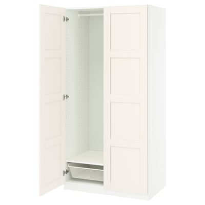 White PAX wardrobe with one door open, showing interior mesh basket and shelf.
