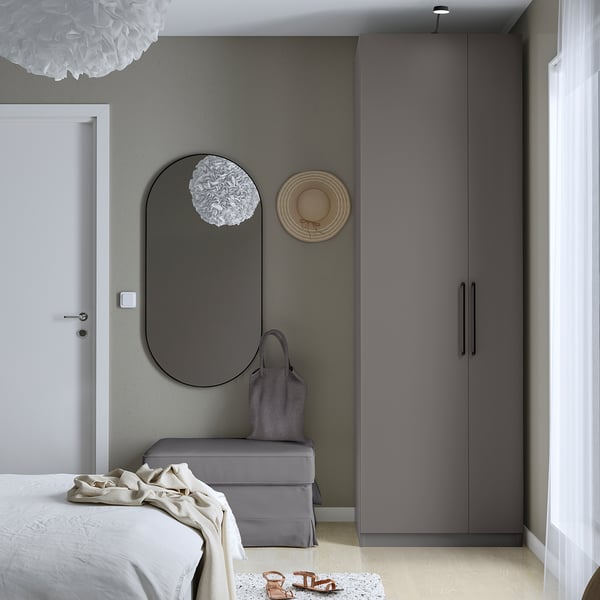 Modern grey PAX wardrobe, large mirror, ample storage.