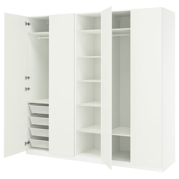 A white PAX wardrobe with open doors revealing shelves and drawers.