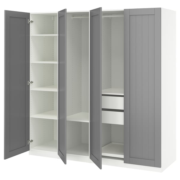 An open ikea PAX wardrobe in gray with multiple shelves inside.