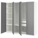 An open ikea PAX wardrobe in gray with multiple shelves inside.