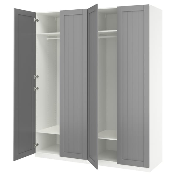 An open grey IKEA PAX wardrobe with shelves and a hanging rod.