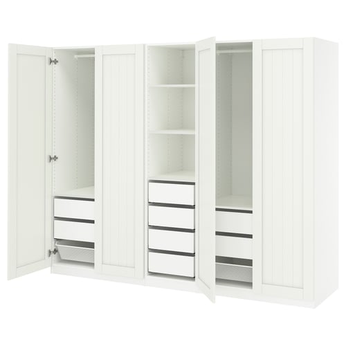 White PAX wardrobe, three sections with shelves and drawers; two doors open.