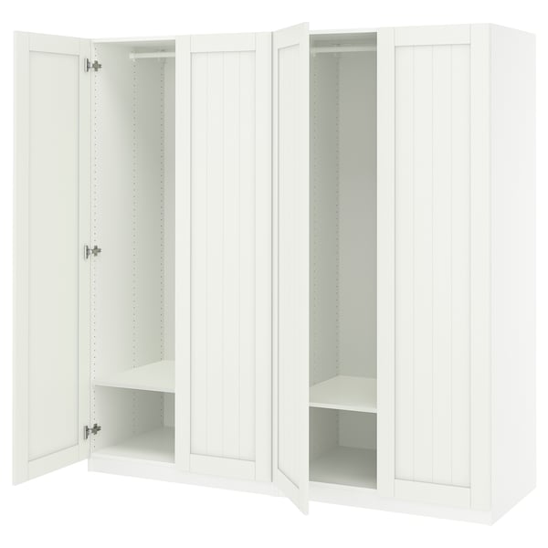 White PAX wardrobe with open doors, featuring shelves and hanging space.