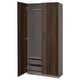 A tall, dark brown PAX wardrobe with grey interiors and mesh shelves, featuring soft-close doors.