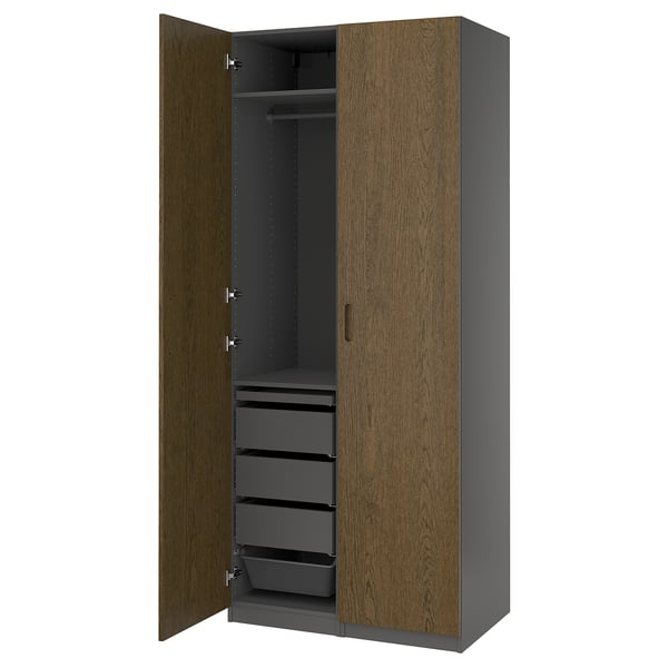 An a PAX wardrobe in brown with drawers and a hanging rod.