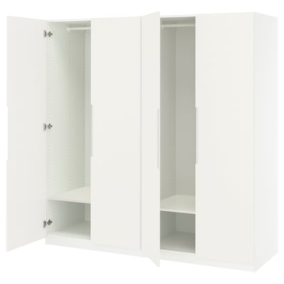White PAX wardrobe with open doors, adjustable shelves, soft-close hinges.