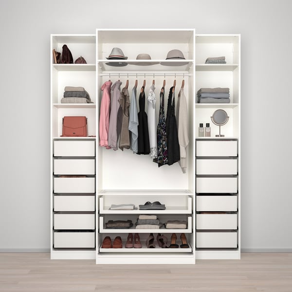 Closet with clothes hangers, shelves, and drawers for organised storage.