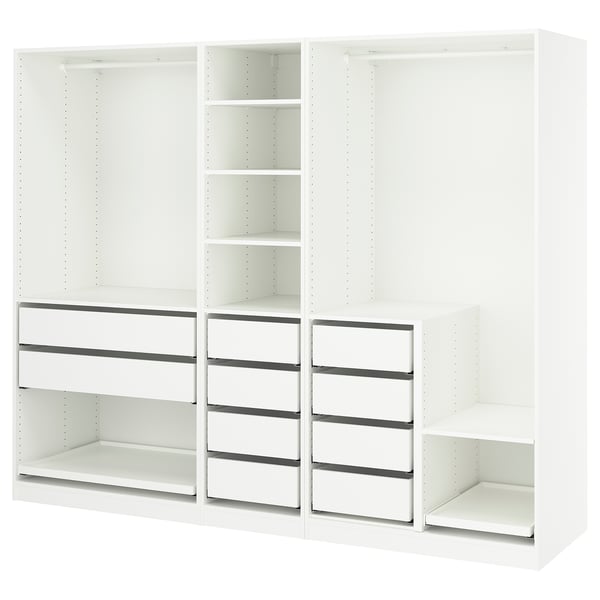 White PAX wardrobe system by IKEA, open design with shelves and drawers.