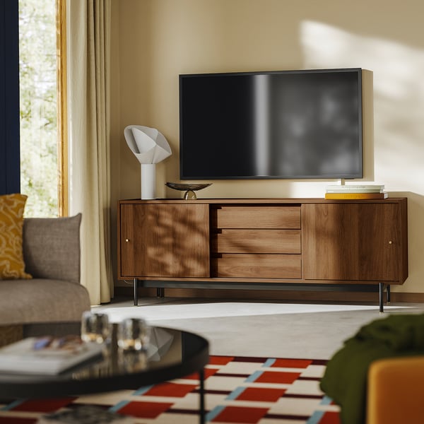 Walnut tv bench with flat screen, mid-century design and storage.