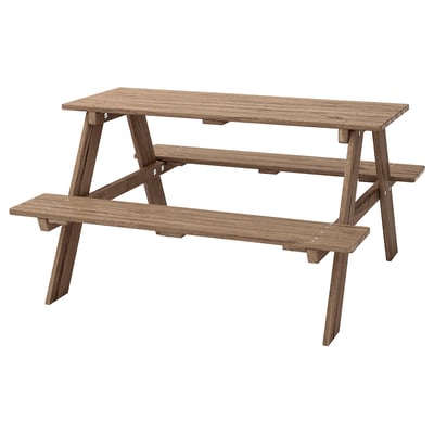 Brown childrens picnic table with attached seats, made from solid acacia wood.