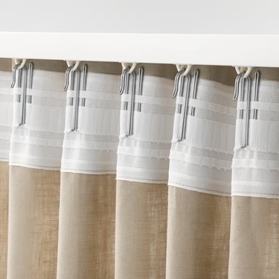 Image shows curtain hooks holding fabric with gathering tape for easy hanging.