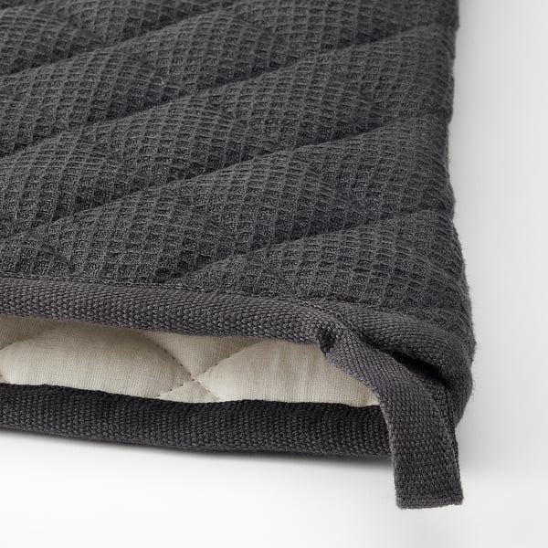 A dark grey oven mitt with a textured surface, featuring a sturdy, secure edge.