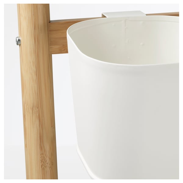 White planter on wood stand